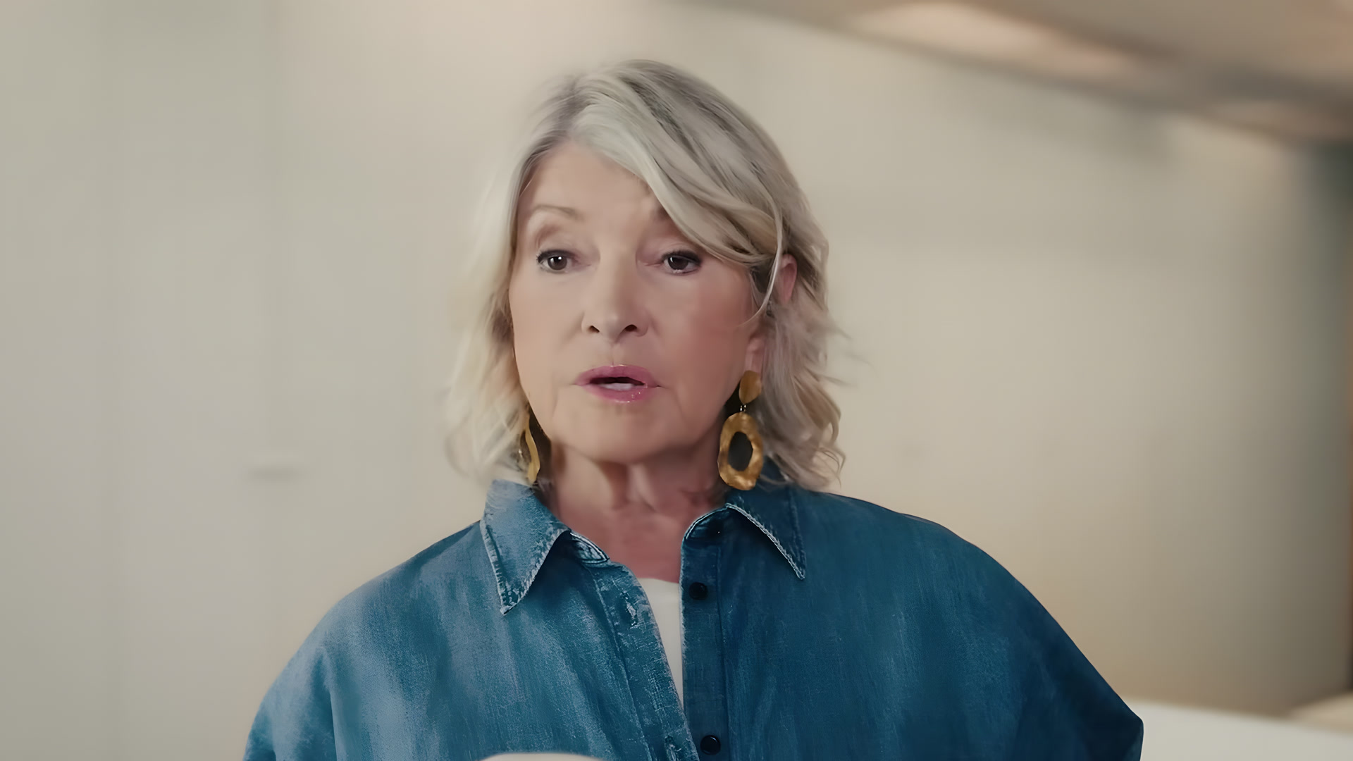 Denim shirt and gold earrings