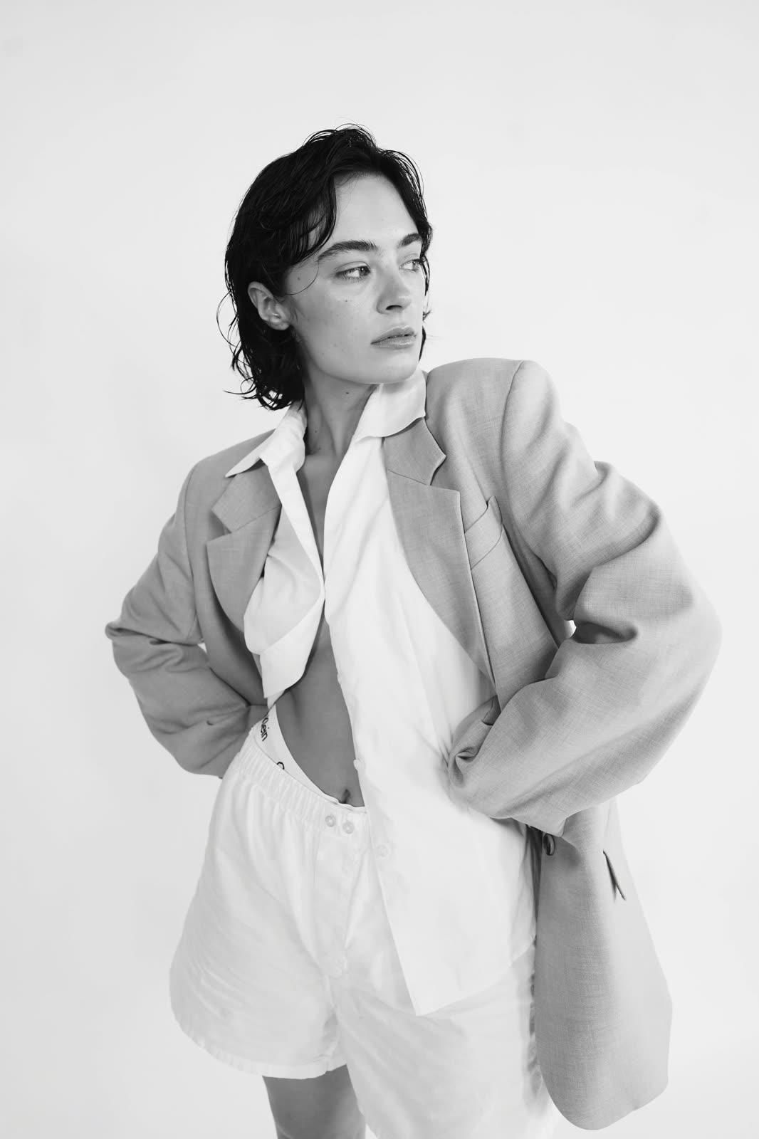 Black and white: Reilly Hail in an oversized grey blazer, open white shirt and white shorts