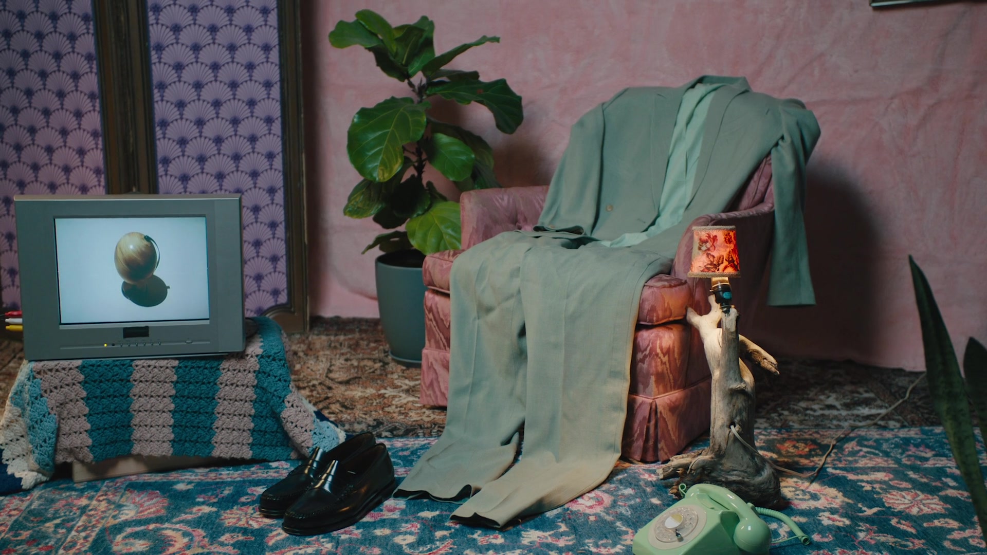 Sage suit left on the armchair